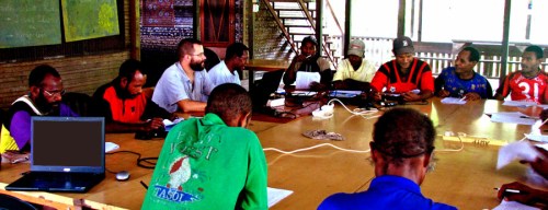 A translation consultant checking the book of Acts with a team of national translators